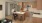 a man and woman sitting at a kitchen table