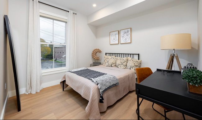 Bedroom with natural lighting and high ceilings
