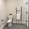 a bathroom with a toilet and a glass shower