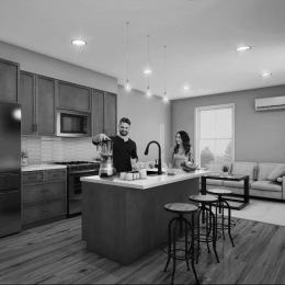 a couple in the kitchen cooking food