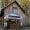 a barn with a tent in front of it